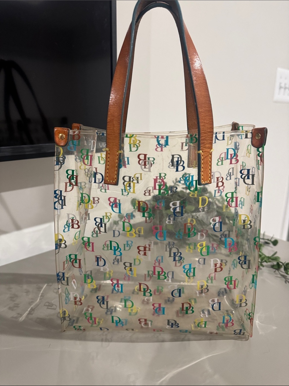 Dooney & Bourke Clear Tote with Multicolor DB Logo and Brown Handles